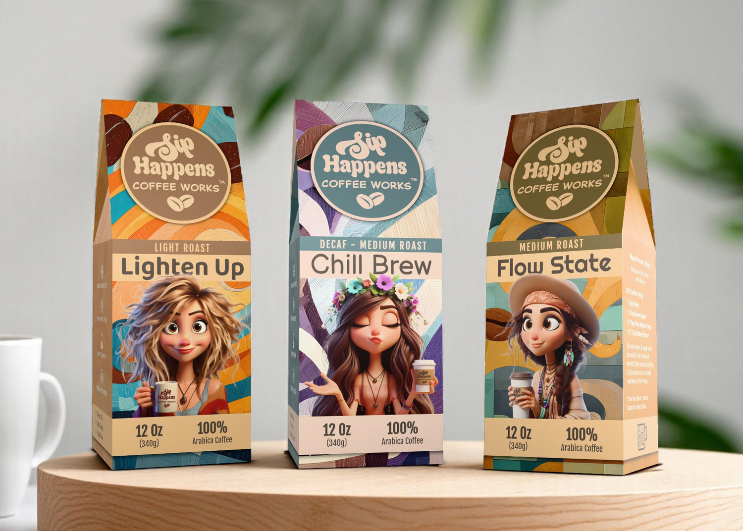 Three coffee packages from 'She Happens Coffee Works' on a wooden surface with a blurred background.